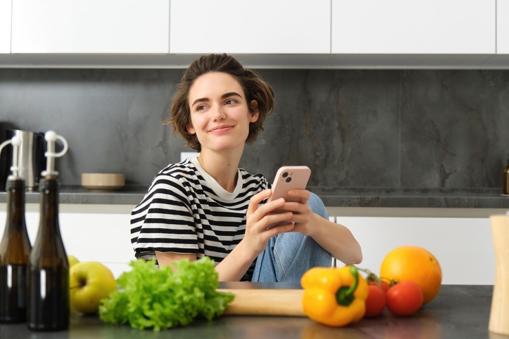 Woman checking a healthy recipe on her phone